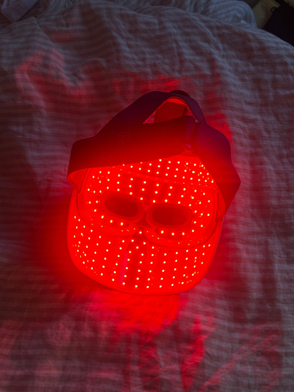 Red LED face mask designed for light therapy.