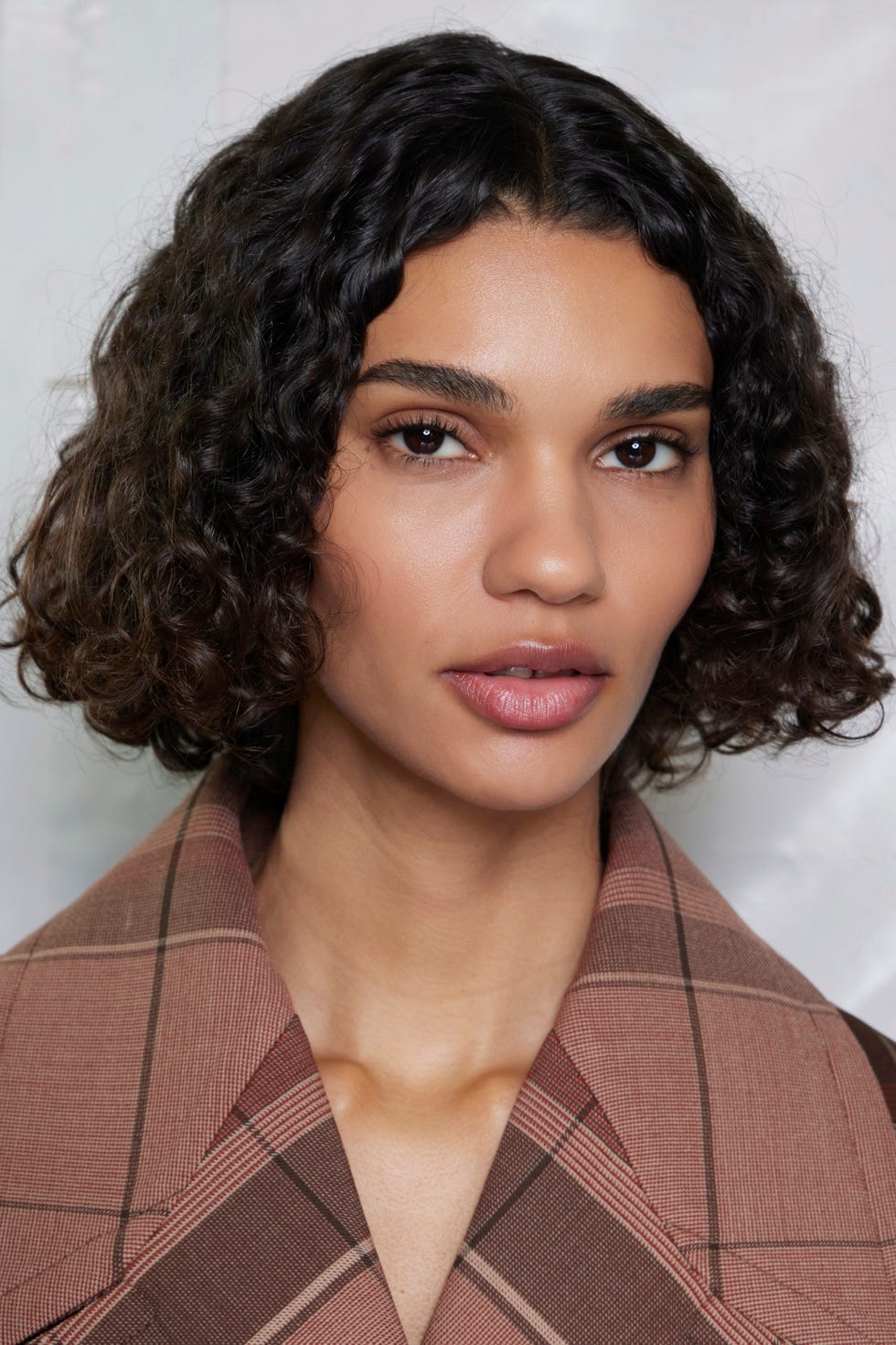 Model showcasing fashion with a blurred face for anonymity Model showcasing fashion with a blurred face for anonymity