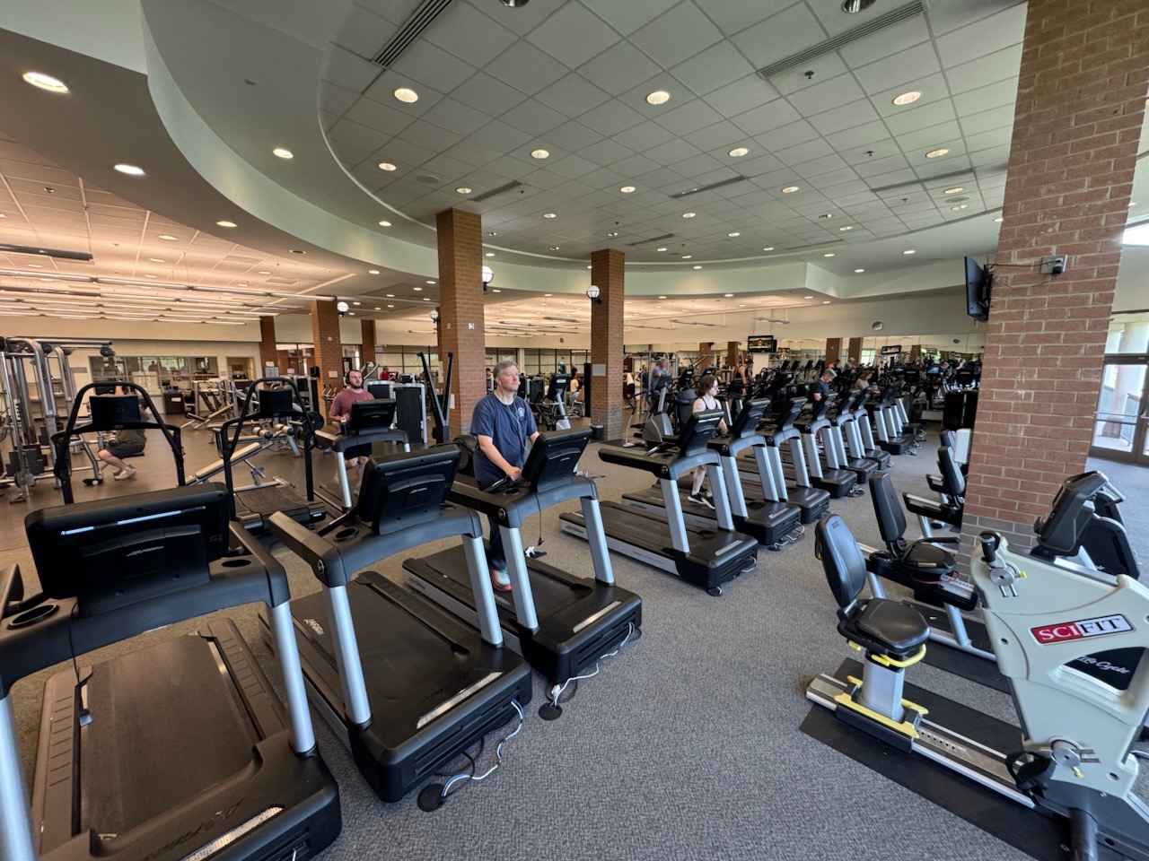 A row of treadmills inside the fitness room of Ida Lee