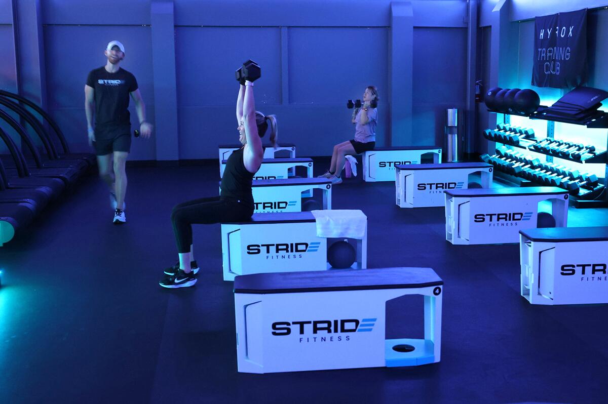 A High-Intensity Interval Training (HIIT) class in session at Stride Fitness in Huntington Beach.