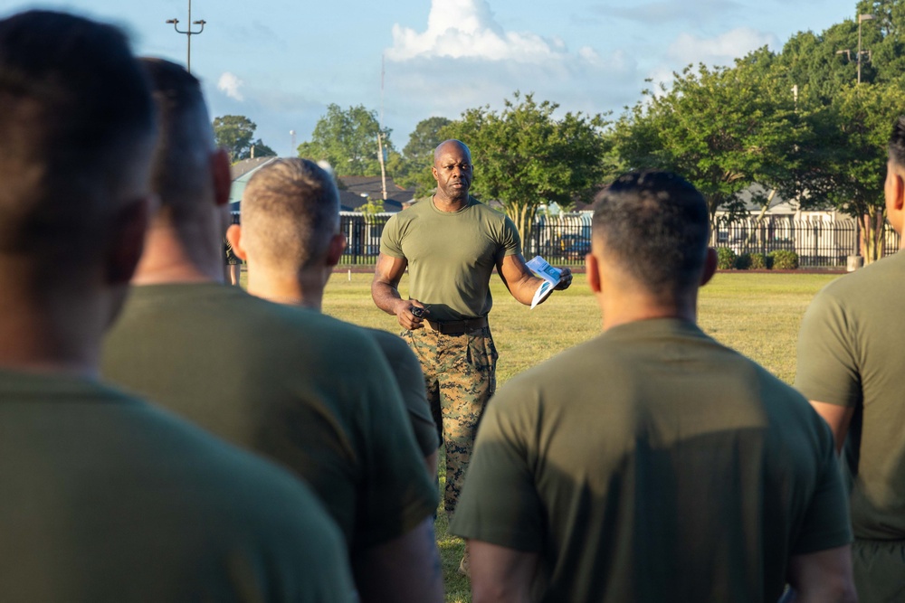 Marines attending 1st Sgts. Symposium Conduct physical training