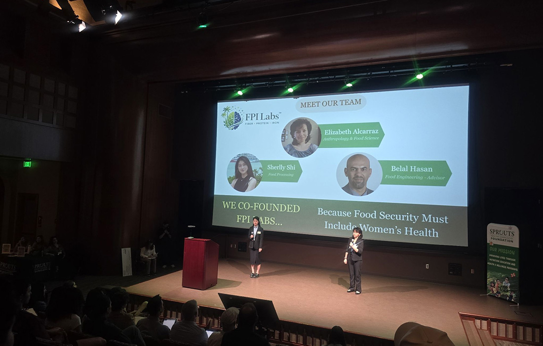 Students on stage during a presentation on Food Security