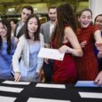 Boston, MA - March 20: Fourth-year medical students reach for their Match Day envelopes at Boston University Chobanian & Avedisian School of Medicine on March 20, 2026. (Photo by Erin Clark/The Boston Globe via Getty Images)
