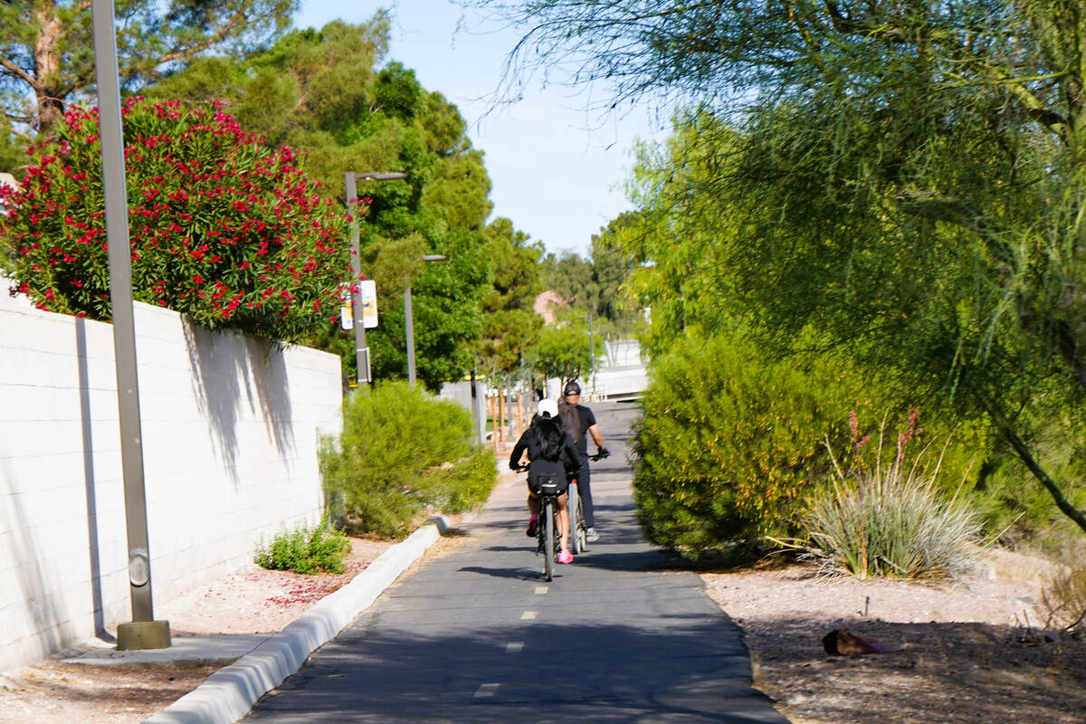 Bicyclists ride along the popular Pittman Wash Trail in Henderson in May. The paved pedestrian ...