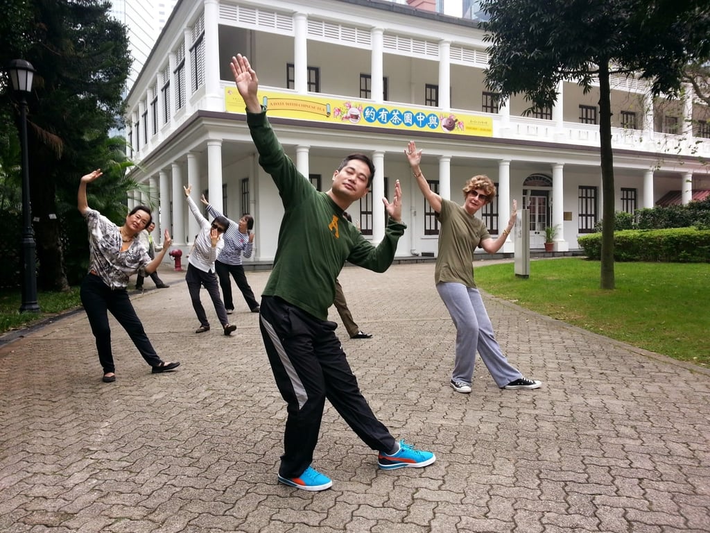 Qigong and tai chi practitioner Lawrence Tse (centre) leads a class in Hong Kong Park. Photo: Lawrence Tse