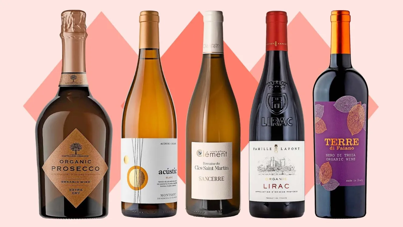 Five bottles of organic wine, including prosecco, white, and red wines.