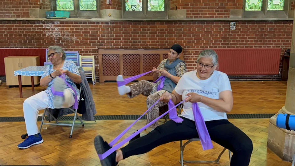 Three ladies doing stretching excercises 