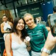 Elemis ambassador Jessica Hawkins posing with F1 fans at the Singapore Grand Prix.