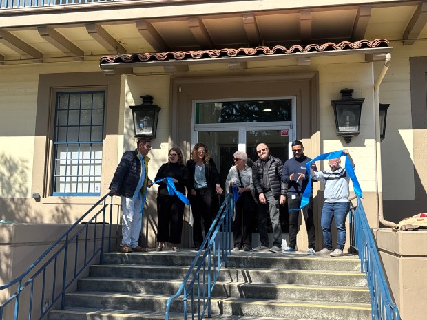 Cabrillo College President Jenn Capps, Dean of Students Michelle Donohue-Mendoza and the school's Board of Trustees cut the ribbon outside of the new wellness center Monday afternoon. (Caroline Hemphill Santa Cruz Sentinel)