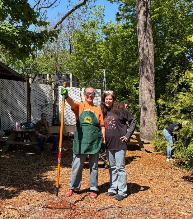 Suzanne Smith, Chair of the Arbor Day committee, with the Crabapple 'Sugar Tyme' tree that she and Olivia Brady planted. (Photo courtesy of Norristown Garden Club)