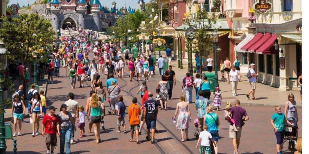 Guests walk down Main Street, U.S.A. at Disneyland Paris.