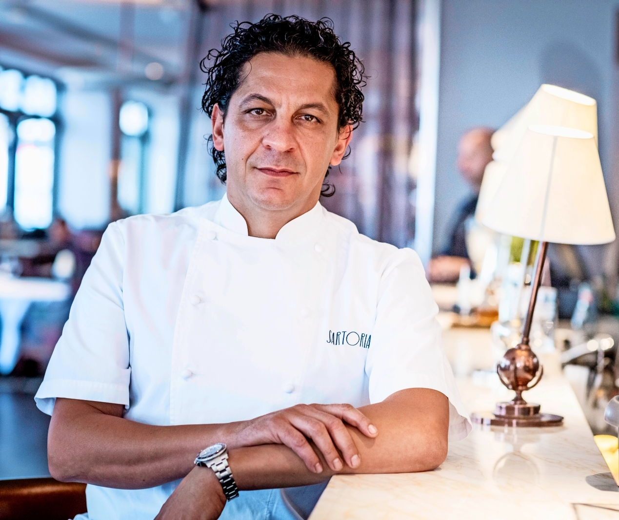 Chef Francesco Mazzei in a white chef's coat.