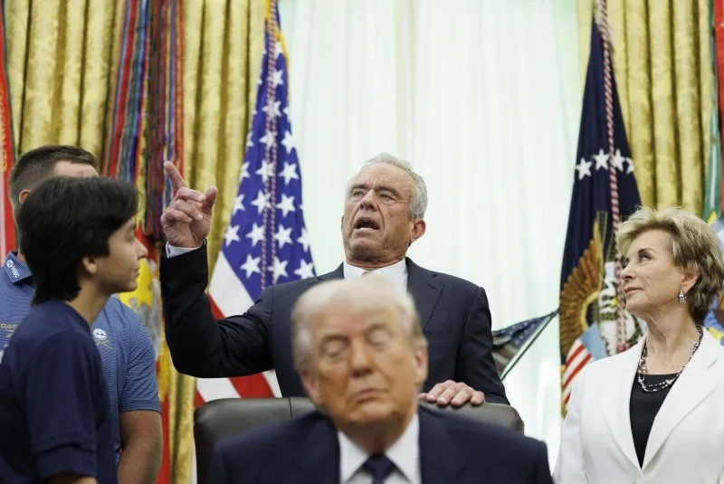 U.S. Health and Human Services Secretary Robert F. Kennedy Jr. speaks behind President Donald Trump ahead of a proclamation signing Tuesday inside the Oval Office at The White House in Washington, D.C. Photo by Tom Brenner/UPI