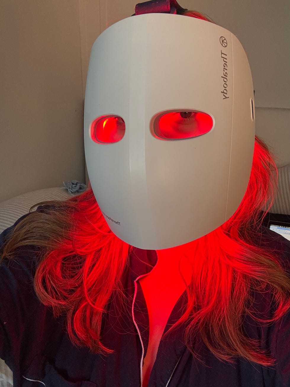LED facial mask being worn by a person.
