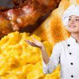 Chef presenting a classic American breakfast with scrambled eggs, bacon, and buttered toast.