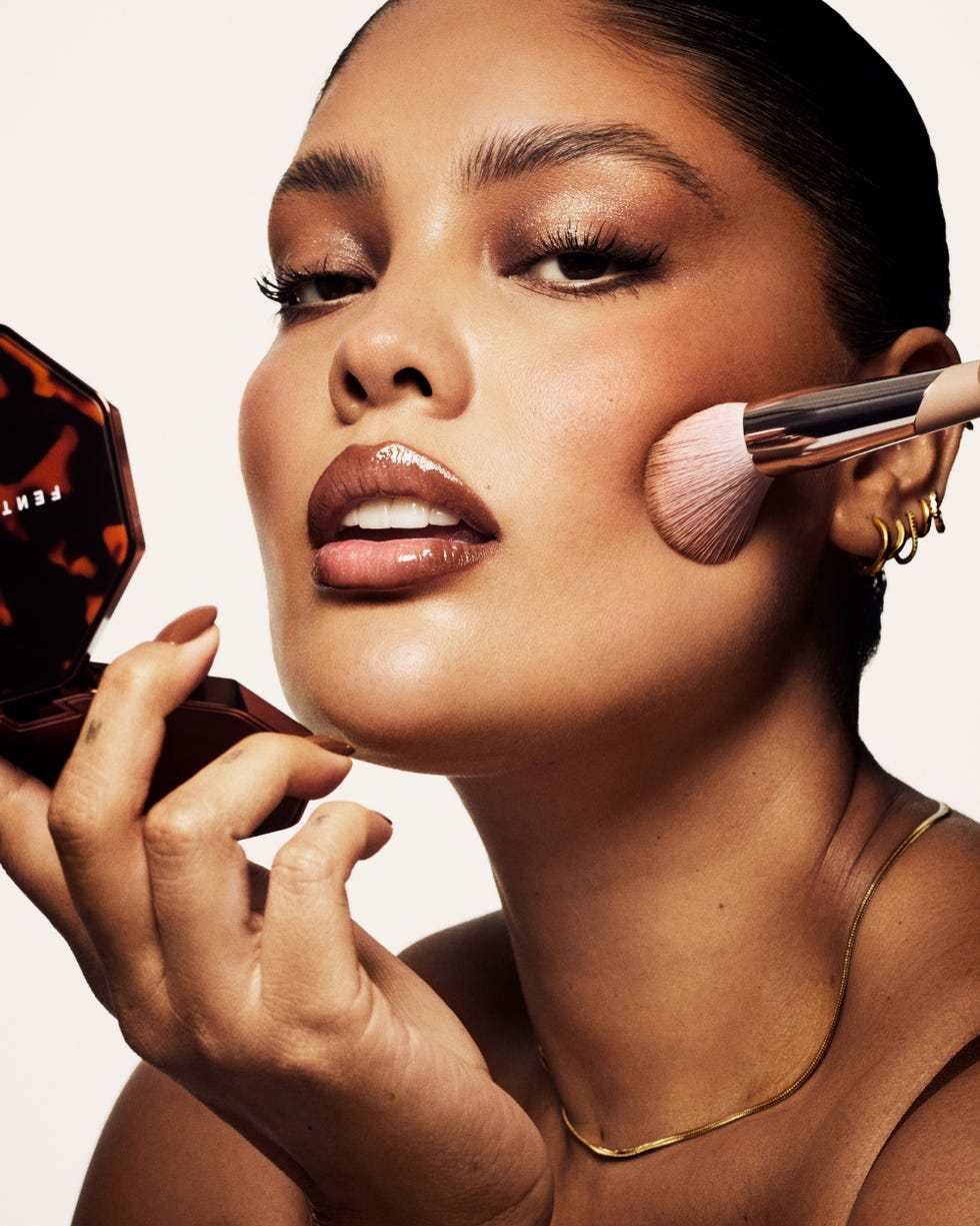 Model applying Fenty Beauty Bronzer