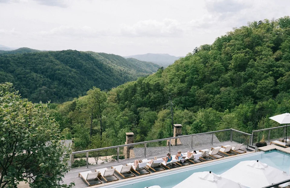 The expansive, crowd-free mountain views and pool deck at Blackberry Mountain in Walland, Tennessee, offer deep somatic grounding.