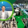 Vitafoods 2026 Novonesis video thumbnail: Smiling woman highlighted over the Novonesis booth display