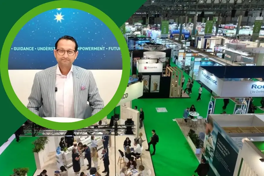 Vitafoods 2026 Novonesis video thumbnail: Smiling woman highlighted over the Novonesis booth display