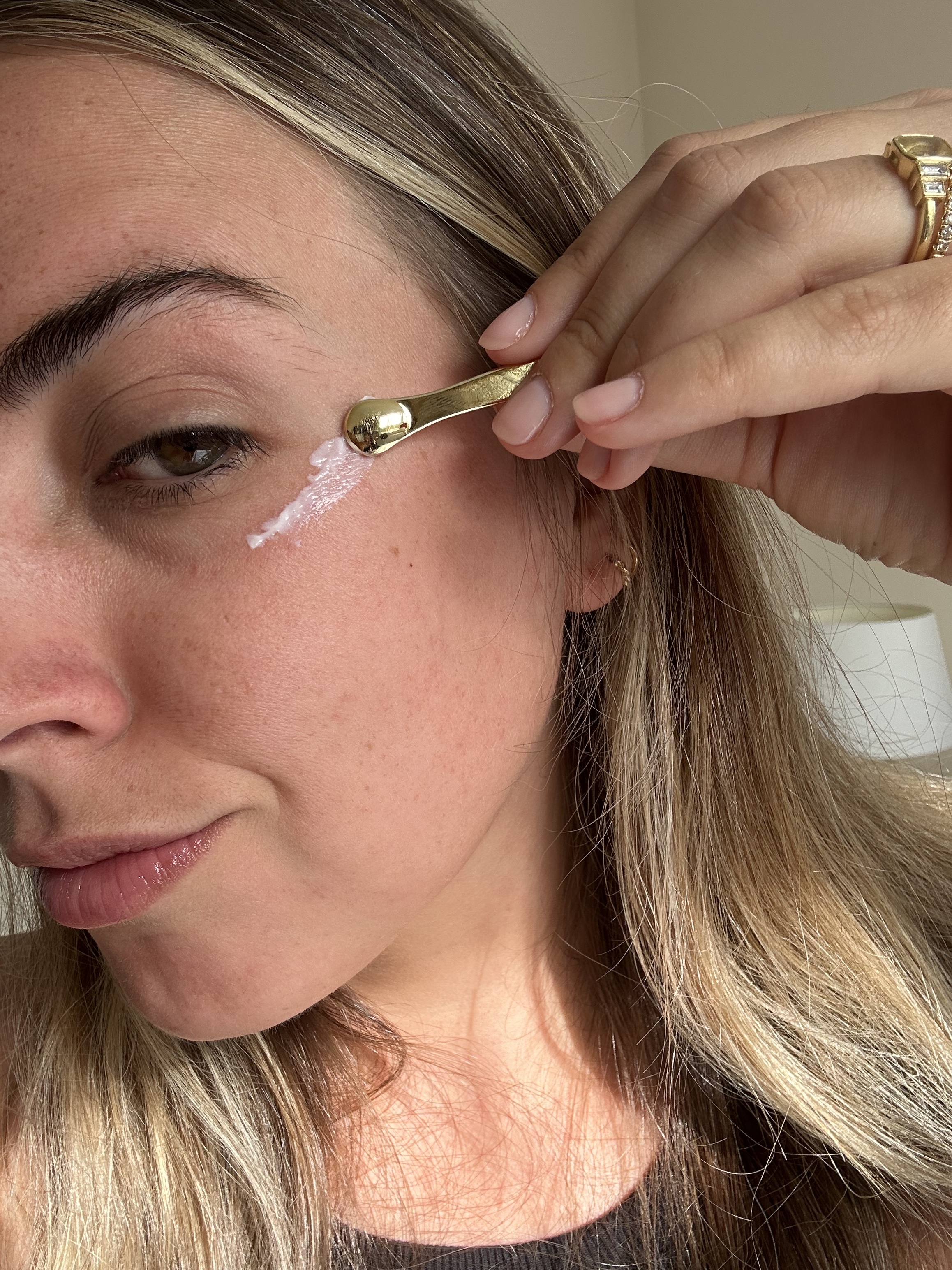 Shannon Lawlor applying tatcha Brightening Eye Cream