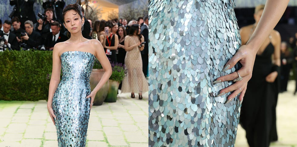 A woman in a sequined strapless dress at an event.