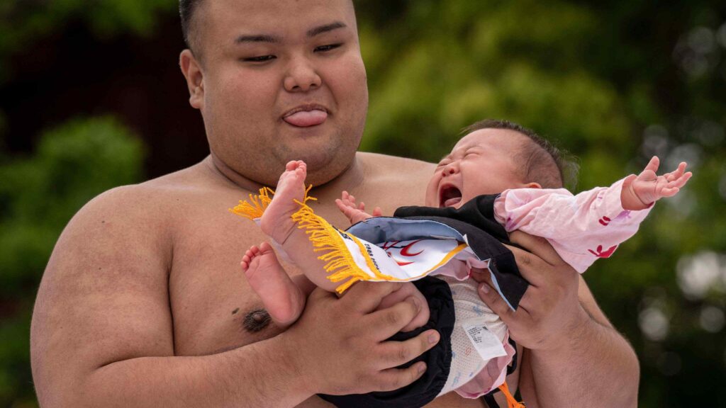 Write a funny caption for this event where wrestling and wellness collide