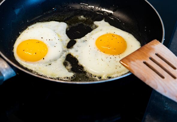 skilled with fried eggs and wooden s poon