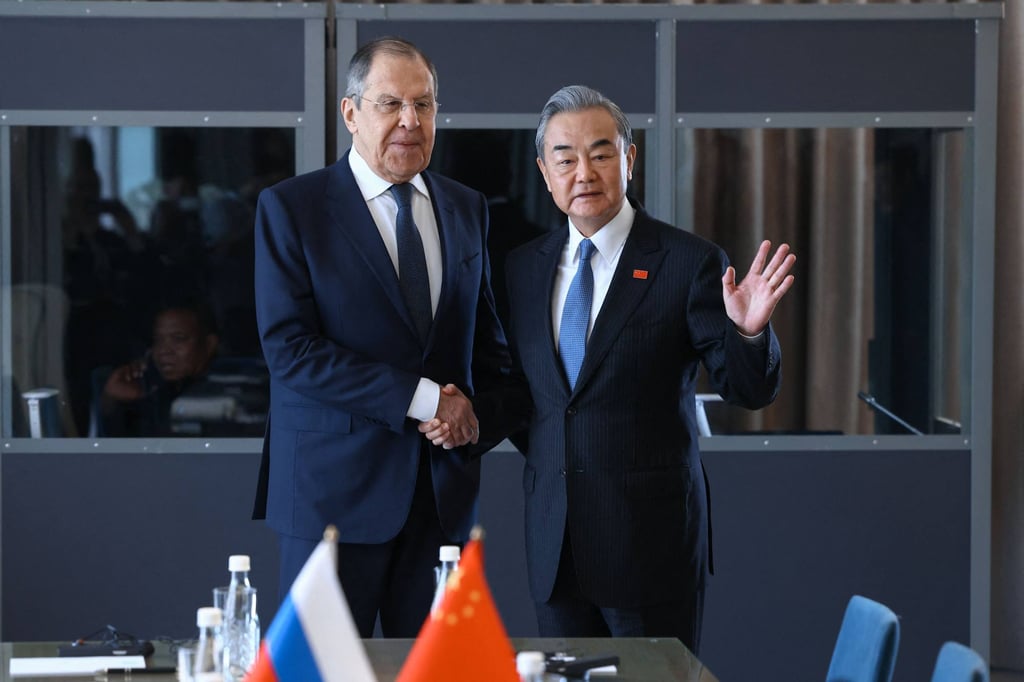 Russian Foreign Minister Sergey Lavrov meets Chinese Foreign Minister Wang Yi on the sidelines of a Group of 20 gathering in Johannesburg, South Africa, in February 2025. Photo: AFP