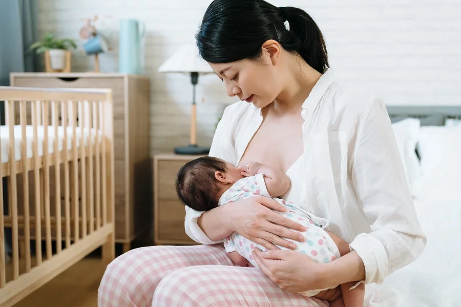 Asian mother breastfeeding baby