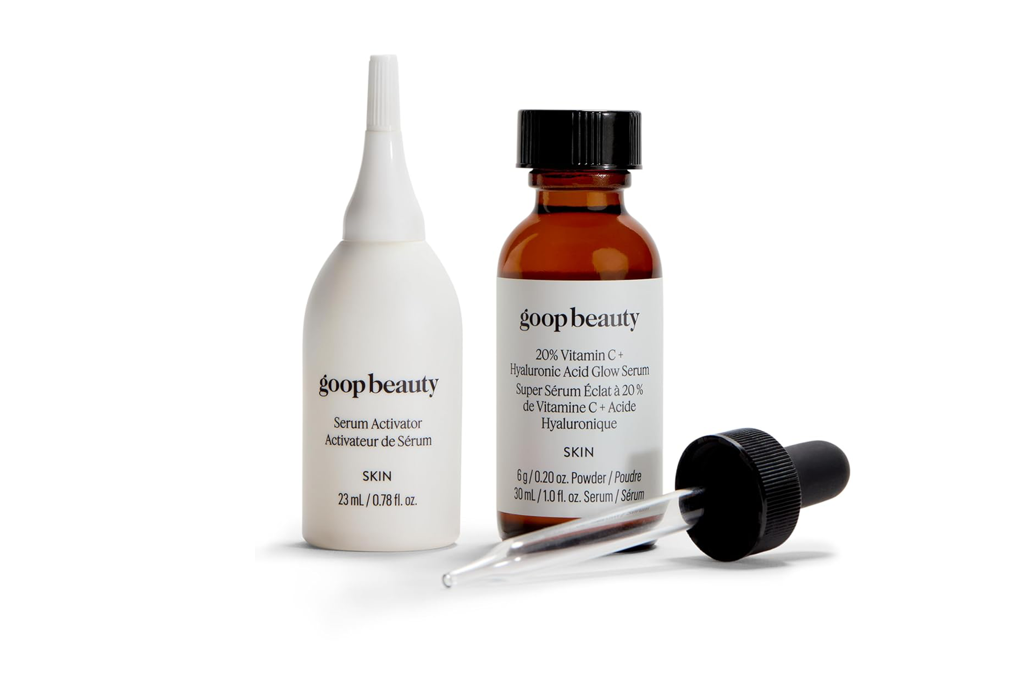 Goop Beauty 20% Vitamin C + Hyaluronic Acid Glow Serum with a dropper and a Serum Activator bottle.