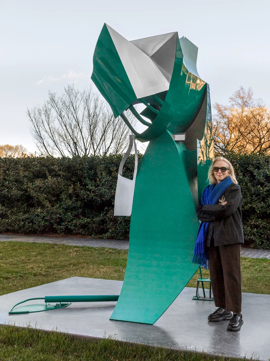 Artist Arlene Shechet stands with her sculpture Maiden May