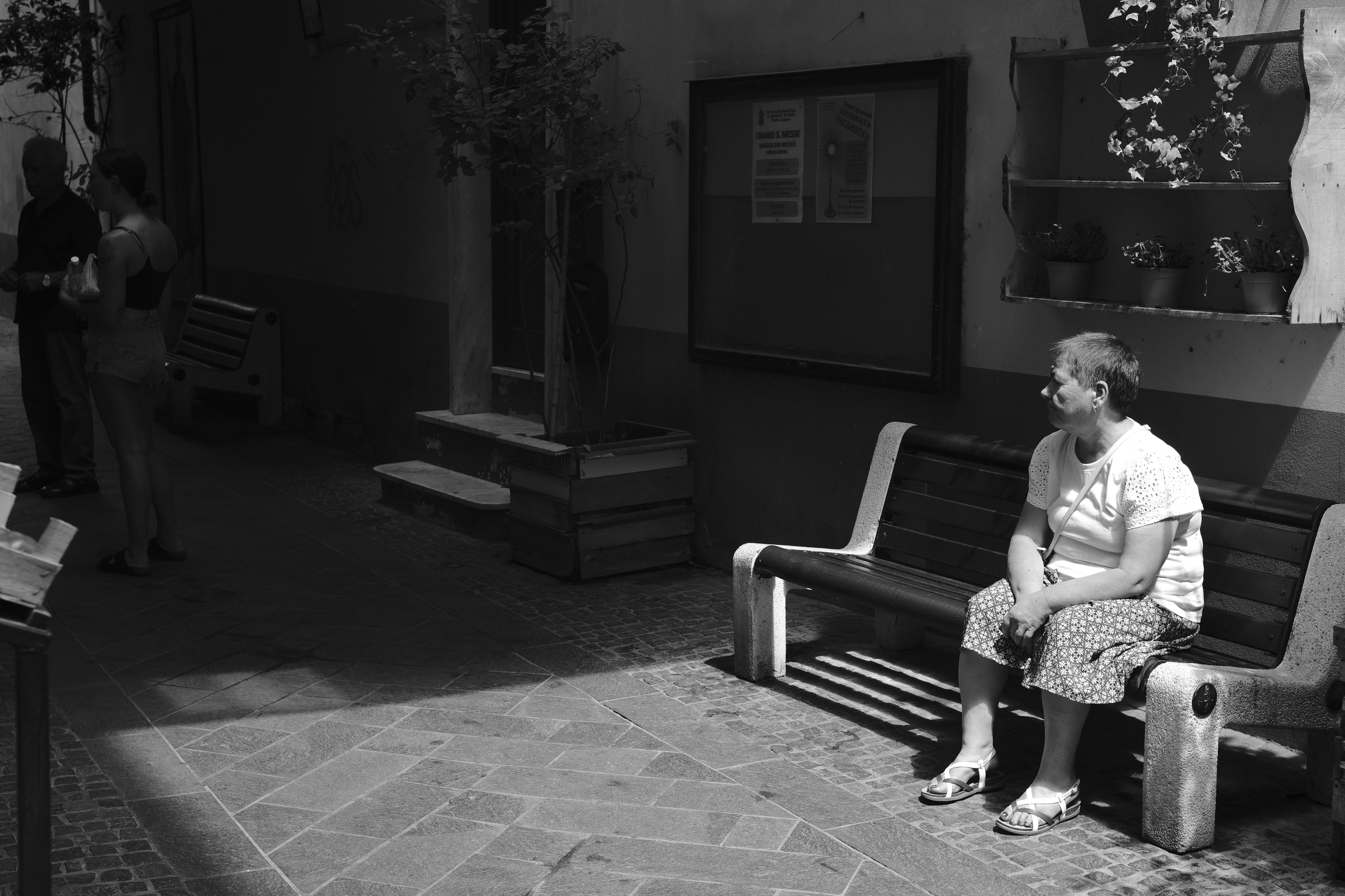 Grandmom sitting on an Italian Street 