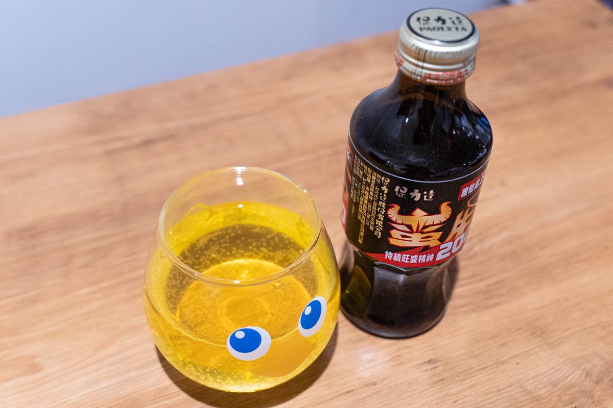Man-New Vitamin B Drink and a glass seen from diagonally above