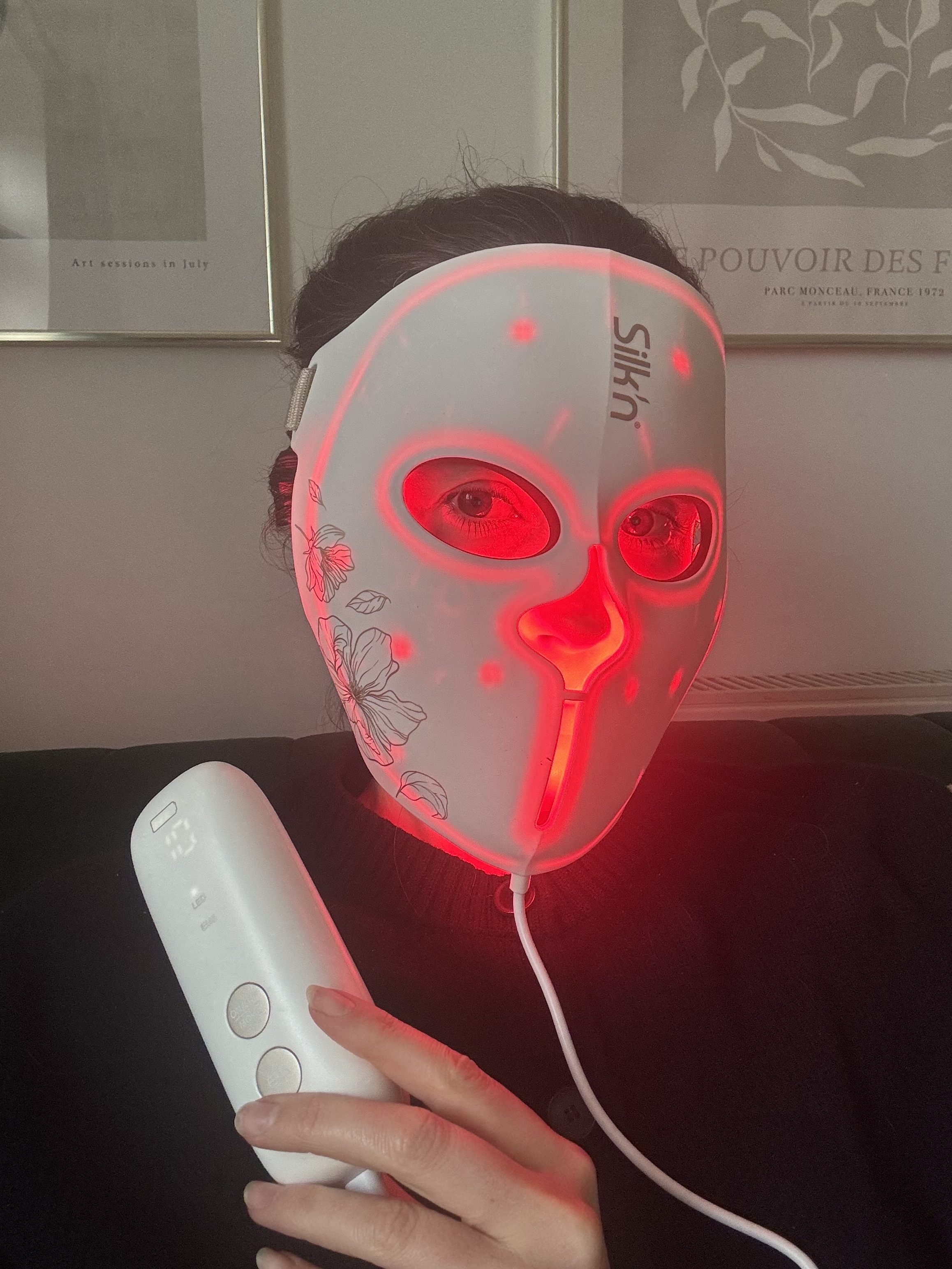 Eleanor using the red light setting of the Silk'n LED EMS face mask