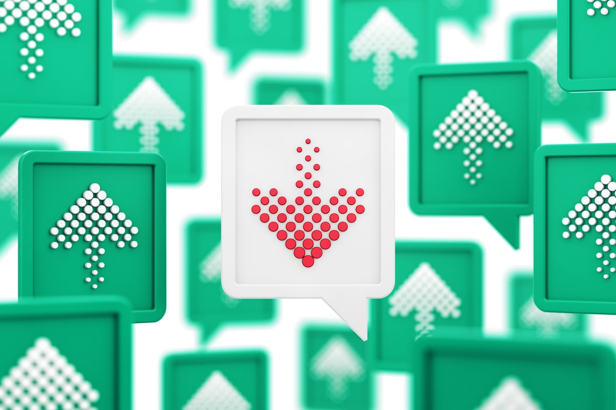 A white block with a red arrow pointing down, sits at the center of numerous green blocks with white arrows pointing up.