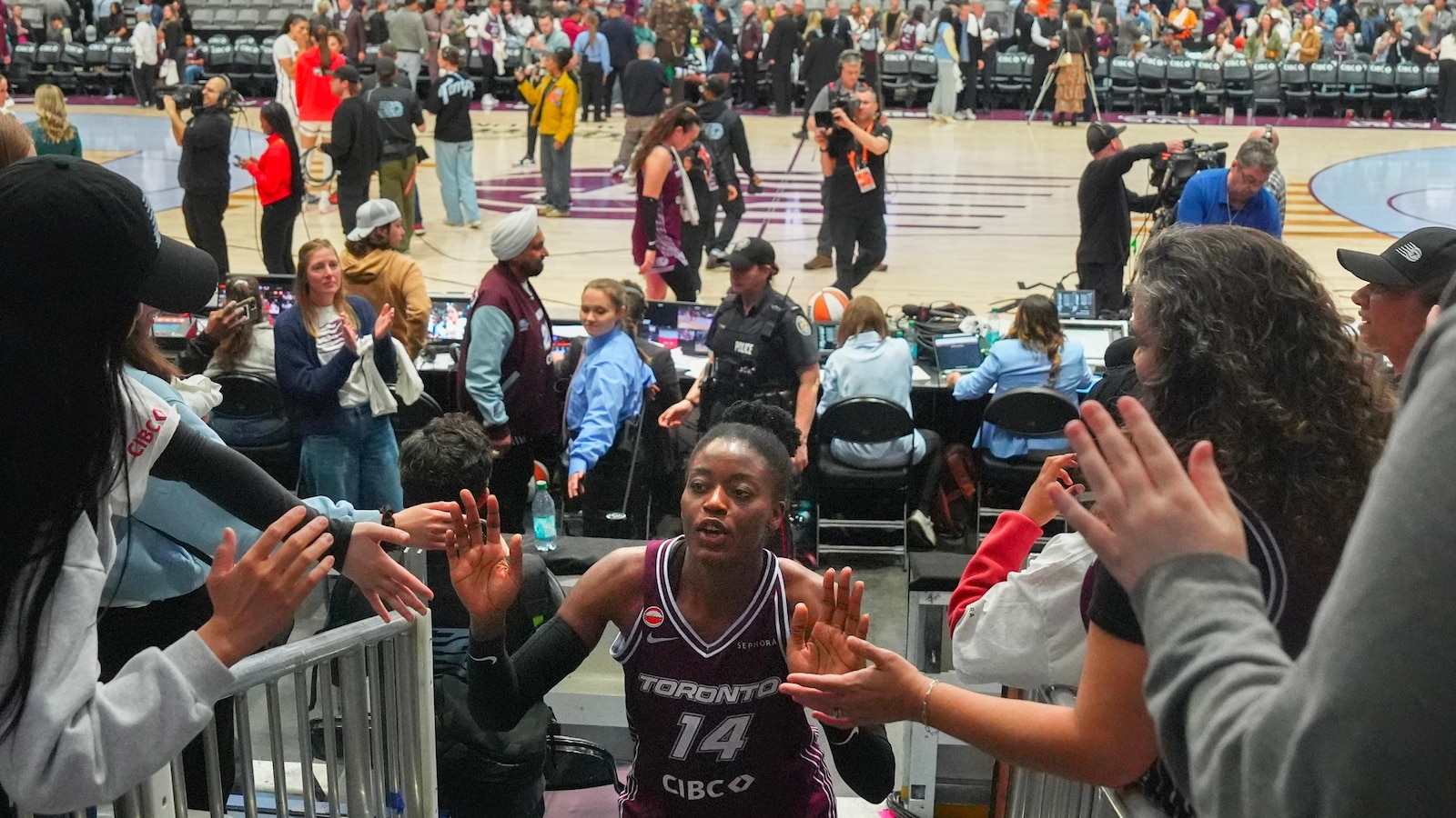 Toronto's first WNBA game is no thing of beauty, but sellout crowd finds plenty to cheer