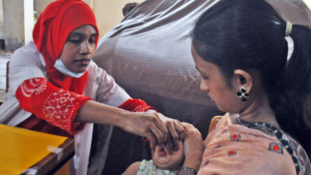 A child is administer Vitamin A capsule as part of the government's national Vitamin A Plus Campaign at Khilgaon's Nagar Matrisadan in Dhaka on 28 June 2026. Photo: Focus Bangla