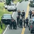 Police arrest a man accused of multiple killings, right, on Thursday, May 28, 2026, in Kaimu, Hawaii. (Deborah Davis via AP)