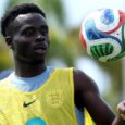 Bukayo Saka tosses a football in the air during an England training session in Florida