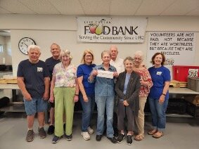 Lake Chelan Food Bank representatives and Lake Chelan Health & Wellness Foundation board members gather for the presentation of a $3,328 donation to the food bank. Pictured are, from left, food bank volunteer Wayne Gordon, Director Richard Springer, foundation board member Susan Fisher, food bank Co-President Shannon Leahy, foundation President Phyllis Gleasman, foundation board members Lester Cooper, Aurora Flores and Mary Signorelli, and food bank Co-President Sue Nadum. The funds were raised through community donations and matching funds from the foundation.
